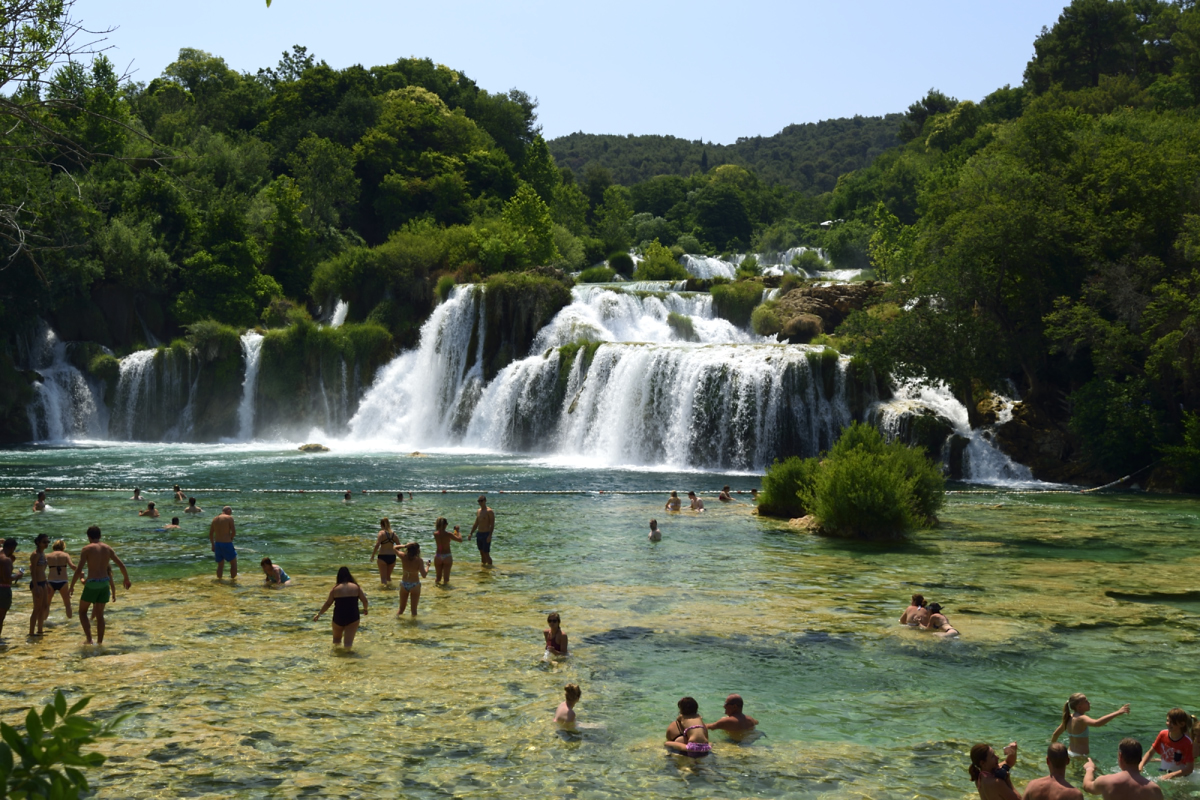 Swimming at Scradinski Buk waterfall in Krka National Park, Croatia